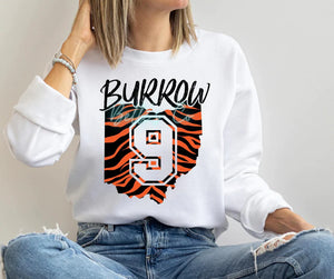 Show your WHO DEY support with this Cincinnati Bengals, Striped Ohio shirt. With the 1 in the middle of the state, represent Joe Burrow with style!