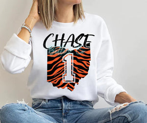 Show your WHO DEY support with this Cincinnati Bengals, Striped Ohio shirt. With the 1 in the middle of the state, represent Jamarr Chase with style! 